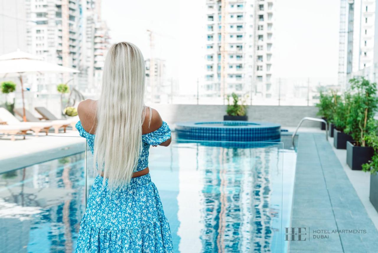 He Hotel Apartments Дубай Екстериор снимка A woman with long hair